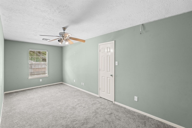 21519 San Marino Dr, Katy, TX 77450 - empty room with a ceiling fan, a textured ceiling, and carpet