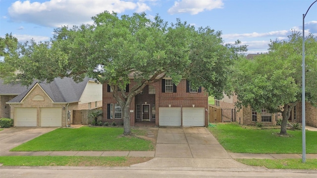 21519 San Marino Dr, Katy, TX 77450 - view of front of home with brick siding, a gate, driveway, and an attached garage