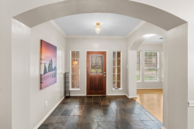 21519 San Marino Dr, Katy, TX 77450 - foyer entrance with ornamental molding, stone tile flooring, and arched walkways