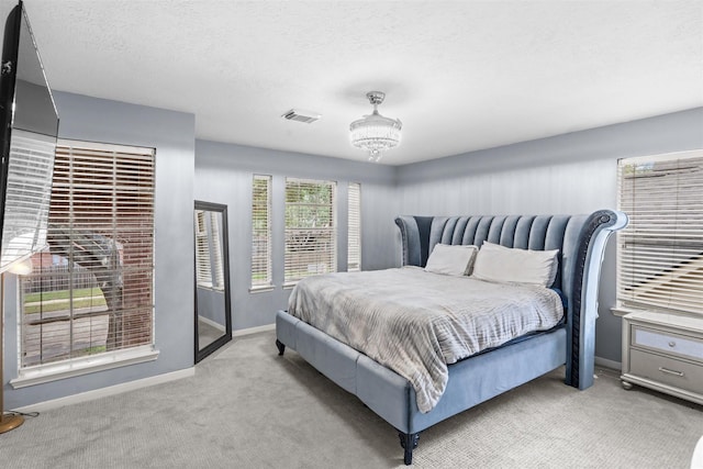 21519 San Marino Dr, Katy, TX 77450 - carpeted bedroom featuring baseboards and a textured ceiling