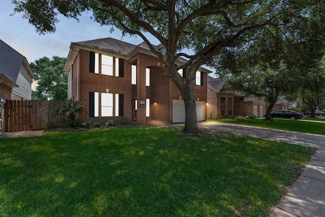 21519 San Marino Dr, Katy, TX 77450 - traditional-style house with driveway, brick siding, and a garage