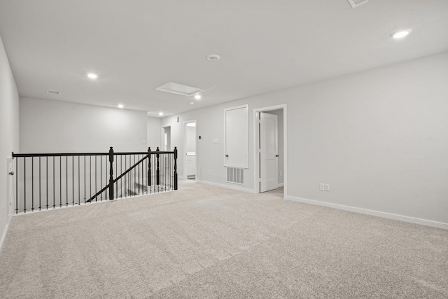 25011 Pomegranate Pl, Montgomery, TX 77316 - unfurnished room featuring recessed lighting, light carpet, and attic access