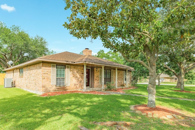 2910 Castle Ct, Pearland, TX 77581 - single story home with brick siding, a chimney, a front lawn, and a shingled roof