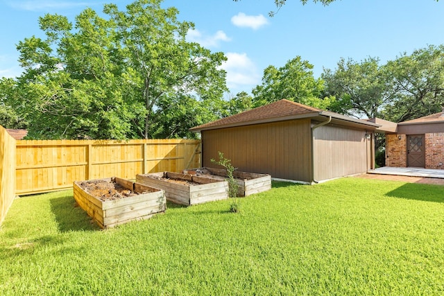 2910 Castle Ct, Pearland, TX 77581 - fenced backyard with a vegetable garden