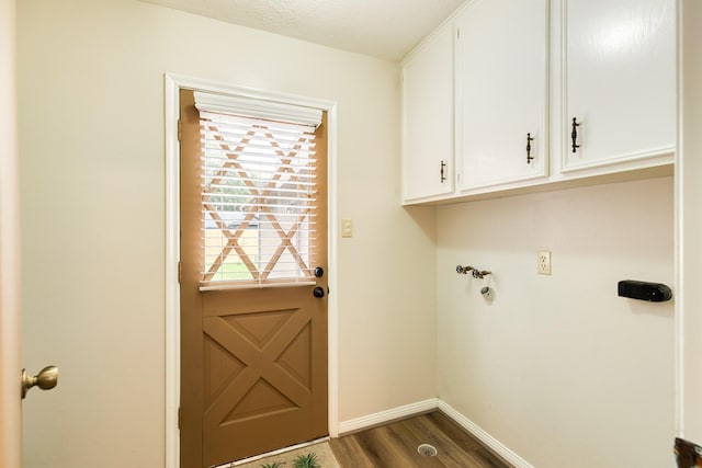 2910 Castle Ct, Pearland, TX 77581 - laundry room with cabinet space and dark wood-style flooring