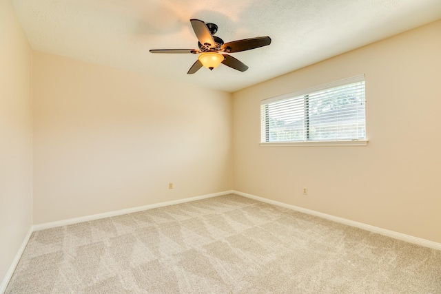 2910 Castle Ct, Pearland, TX 77581 - empty room with light carpet and a ceiling fan
