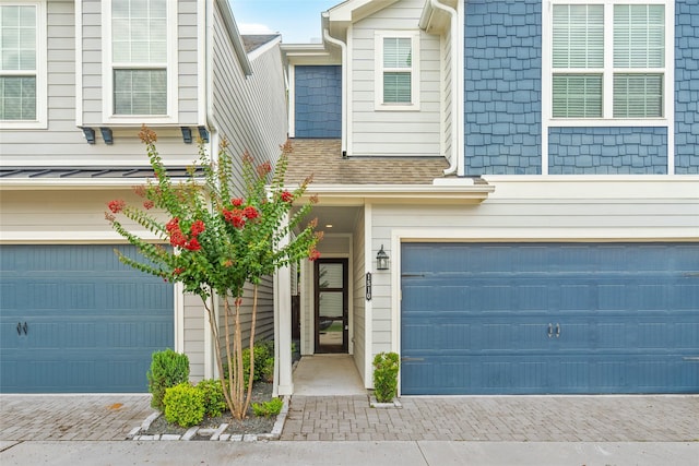 1510 Upland Glen Way, Houston, TX 77043 - townhome / multi-family property featuring a garage, decorative driveway, and a shingled roof