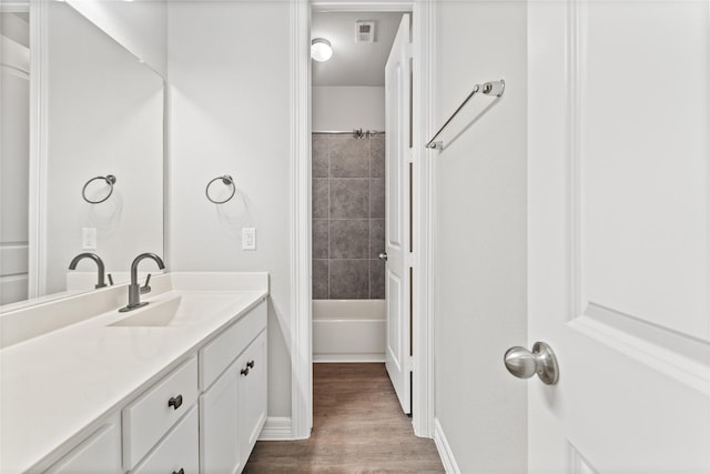 1510 Upland Glen Way, Houston, TX 77043 - bathroom with vanity, wood finished floors, and bathtub / shower combination