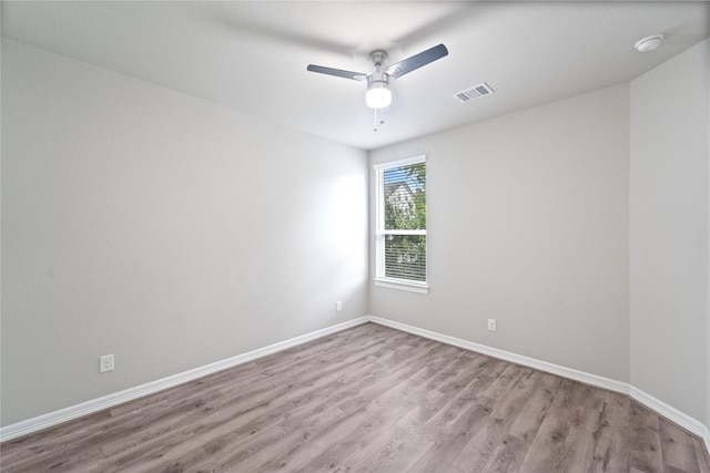 1510 Upland Glen Way, Houston, TX 77043 - spare room with light wood-style flooring, a ceiling fan, and a smoke detector