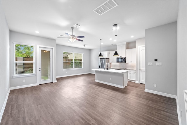 1510 Upland Glen Way, Houston, TX 77043 - unfurnished living room featuring dark wood finished floors, a ceiling fan, and recessed lighting