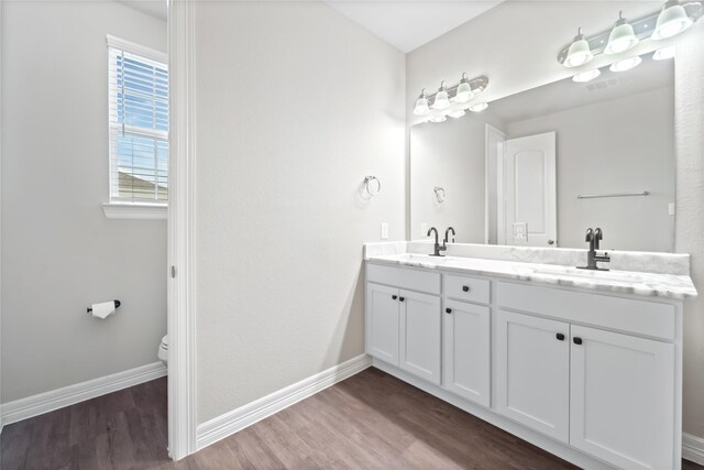 1510 Upland Glen Way, Houston, TX 77043 - full bathroom with double vanity and wood finished floors