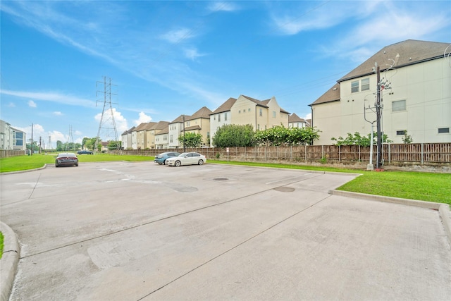 1510 Upland Glen Way, Houston, TX 77043 - uncovered parking lot featuring a residential view