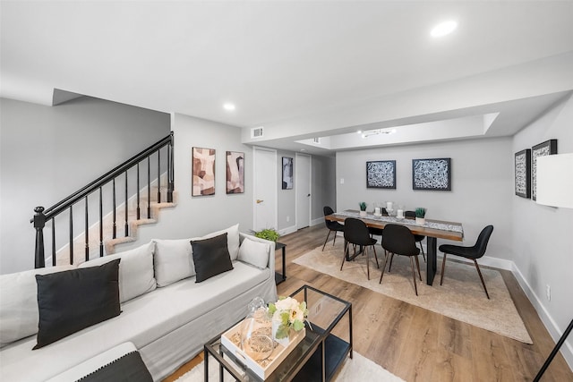 10370 Longmont Dr, Houston, TX 77042 - living room with wood finished floors, stairway, and recessed lighting