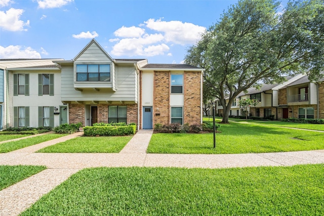 10370 Longmont Dr, Houston, TX 77042 - view of property featuring brick siding and a front lawn