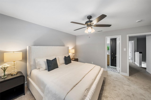 10370 Longmont Dr, Houston, TX 77042 - carpeted bedroom with a ceiling fan and connected bathroom