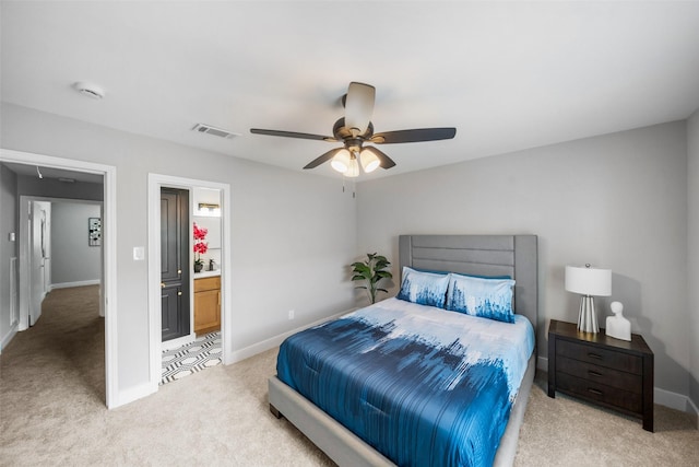 10370 Longmont Dr, Houston, TX 77042 - bedroom with light carpet, a ceiling fan, and ensuite bath