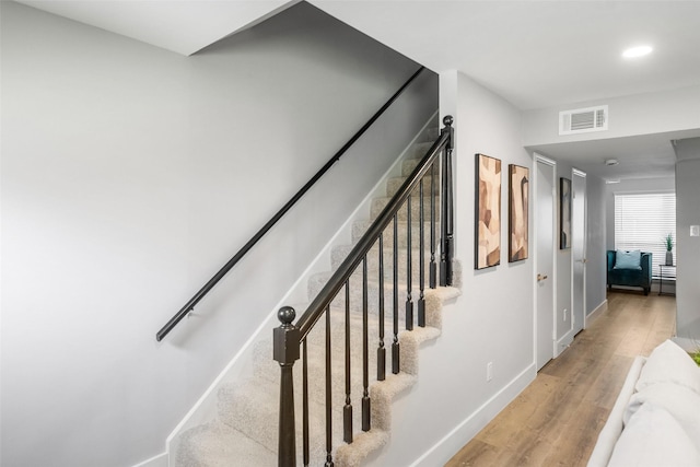 10370 Longmont Dr, Houston, TX 77042 - stairway featuring wood finished floors