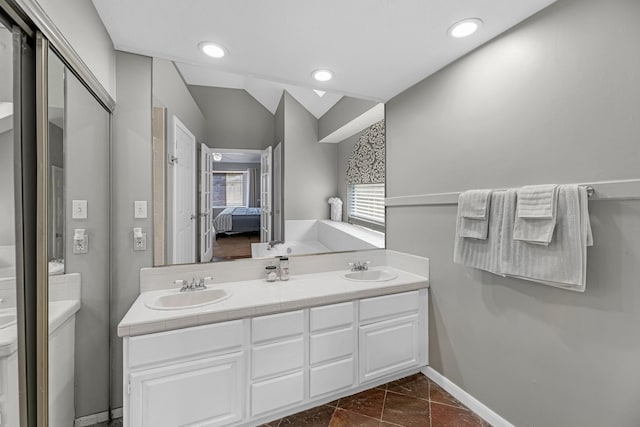 8023 Pine Falls Dr, Houston, TX 77095 - full bathroom featuring double vanity, ensuite bath, lofted ceiling, and recessed lighting