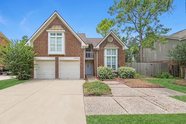 8023 Pine Falls Dr, Houston, TX 77095 - view of front of house featuring an attached garage, driveway, and brick siding