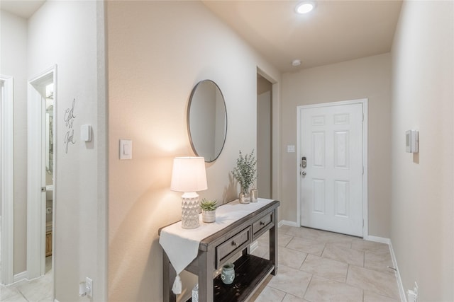 9418 Mcdowell Dr, Richmond, TX 77469 - foyer entrance featuring light tile patterned floors and baseboards