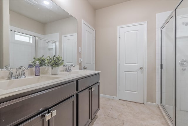 9418 Mcdowell Dr, Richmond, TX 77469 - full bath with double vanity, a shower stall, and tile patterned flooring