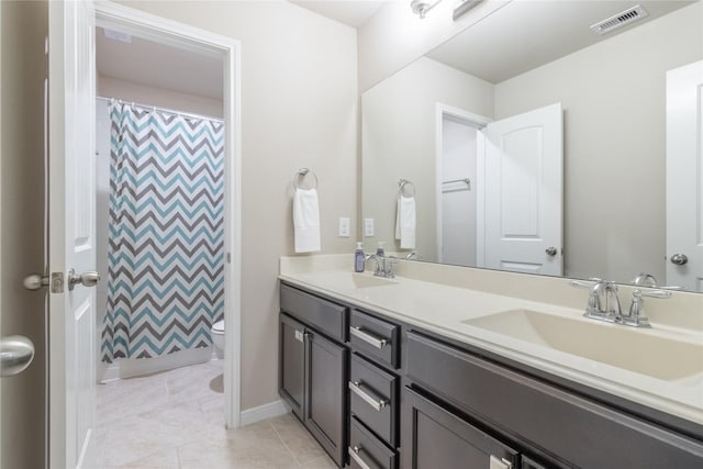 9418 Mcdowell Dr, Richmond, TX 77469 - full bathroom featuring double vanity and tile patterned flooring
