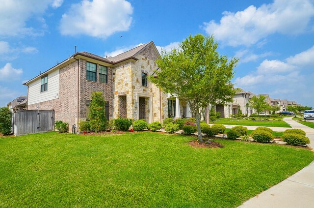 8703 Silver Crest Ln, Missouri City, TX 77459 - view of front of house featuring brick siding and stone siding
