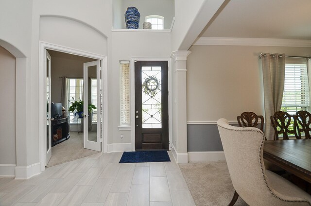 8703 Silver Crest Ln, Missouri City, TX 77459 - foyer entrance featuring healthy amount of natural light and ornamental molding