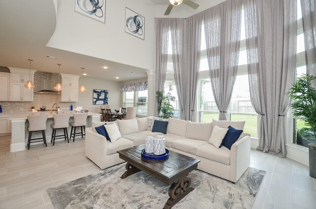 8703 Silver Crest Ln, Missouri City, TX 77459 - living room with a ceiling fan and a high ceiling