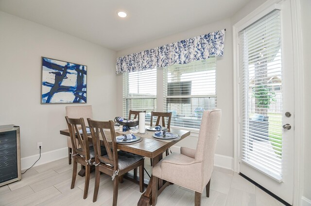 8703 Silver Crest Ln, Missouri City, TX 77459 - dining room with recessed lighting and wine cooler