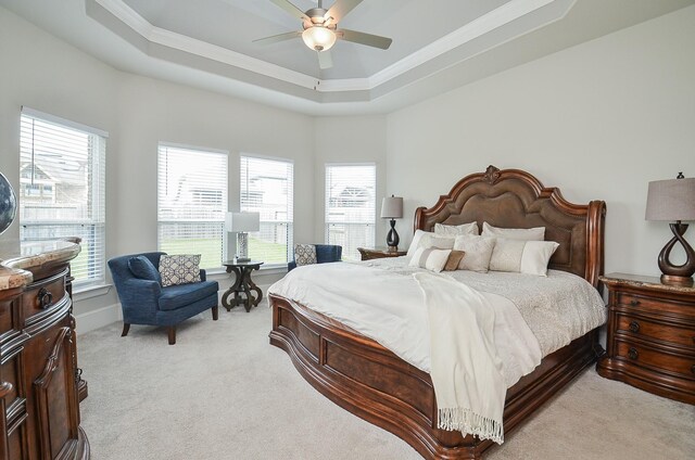 8703 Silver Crest Ln, Missouri City, TX 77459 - bedroom featuring light colored carpet, ornamental molding, a raised ceiling, and ceiling fan