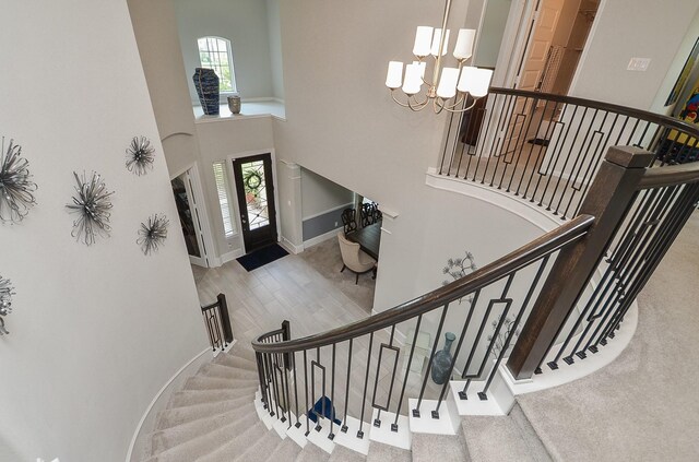 8703 Silver Crest Ln, Missouri City, TX 77459 - entrance foyer with a high ceiling, a chandelier, and stairway