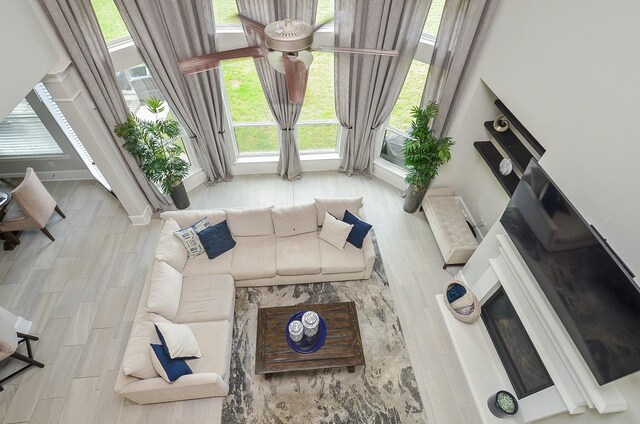 8703 Silver Crest Ln, Missouri City, TX 77459 - living room featuring ceiling fan and healthy amount of natural light
