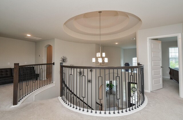 8703 Silver Crest Ln, Missouri City, TX 77459 - hall with an upstairs landing, carpet flooring, a chandelier, and recessed lighting