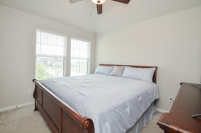 8703 Silver Crest Ln, Missouri City, TX 77459 - bedroom with multiple windows, light carpet, and a ceiling fan