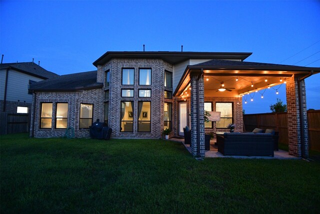 8703 Silver Crest Ln, Missouri City, TX 77459 - rear view of property featuring an outdoor hangout area, a ceiling fan, a fenced backyard, and brick siding