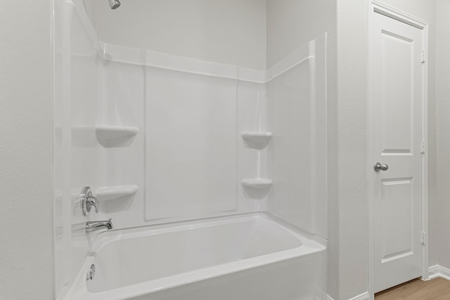 1035 Rosewood Trl, Beasley, TX 77417 - bathroom featuring shower / bathtub combination and wood finished floors