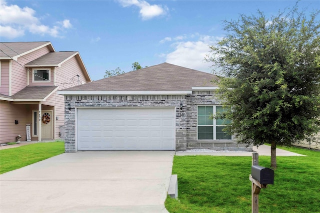 7430 N Star St, Houston, TX 77088 - view of front facade with a garage, driveway, and a front lawn