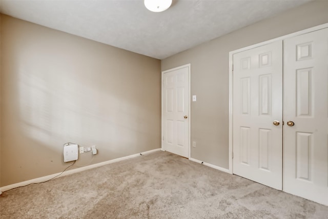 5007 Maple Brook Ln, Kingwood, TX 77345 - unfurnished bedroom featuring carpet flooring and a closet