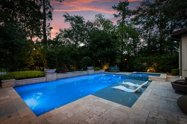 2 N Badger Lodge Cir, The Woodlands, TX 77389 - pool at dusk with a patio and a pool with connected hot tub