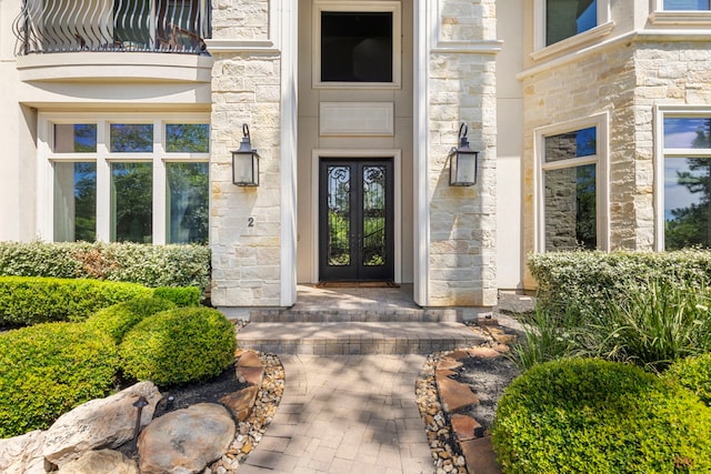 2 N Badger Lodge Cir, The Woodlands, TX 77389 - entrance to property with french doors and stone siding