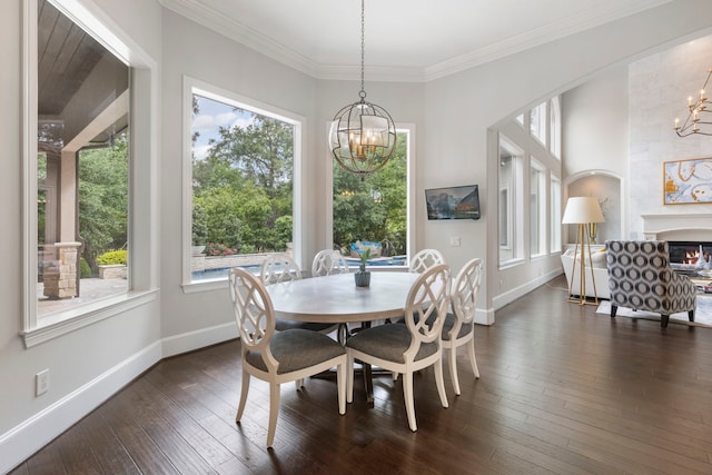 2 N Badger Lodge Cir, The Woodlands, TX 77389 - dining room featuring a chandelier, plenty of natural light, dark wood-type flooring, and ornamental molding