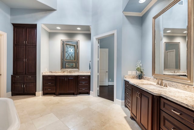 2 N Badger Lodge Cir, The Woodlands, TX 77389 - full bathroom with crown molding, two vanities, and a freestanding tub