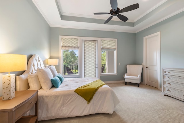 2 N Badger Lodge Cir, The Woodlands, TX 77389 - bedroom featuring crown molding, carpet flooring, a raised ceiling, and a ceiling fan