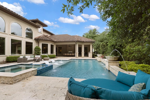 2 N Badger Lodge Cir, The Woodlands, TX 77389 - view of swimming pool with outdoor lounge area, a ceiling fan, a patio area, and a pool with connected hot tub