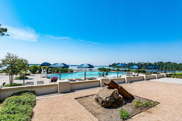 18202 Octavio Frias Trl, Houston, TX 77044 - community pool with a patio and a water view