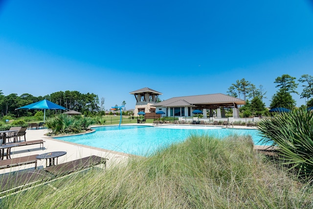 18202 Octavio Frias Trl, Houston, TX 77044 - community pool with a patio