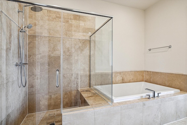 9520 London Bridge Sta, Houston, TX 77045 - full bathroom featuring tiled shower and a garden tub