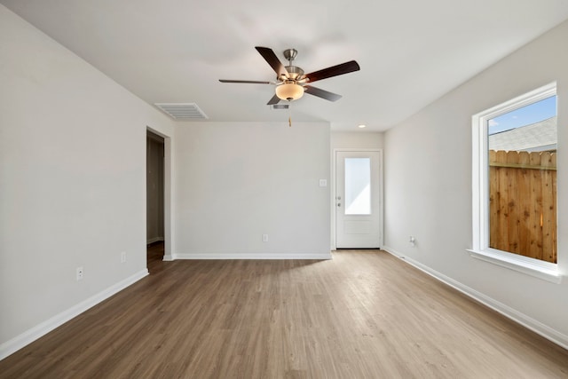 425 Tejas Trl, Waller, TX 77484 - unfurnished room with a ceiling fan, wood finished floors, and healthy amount of natural light