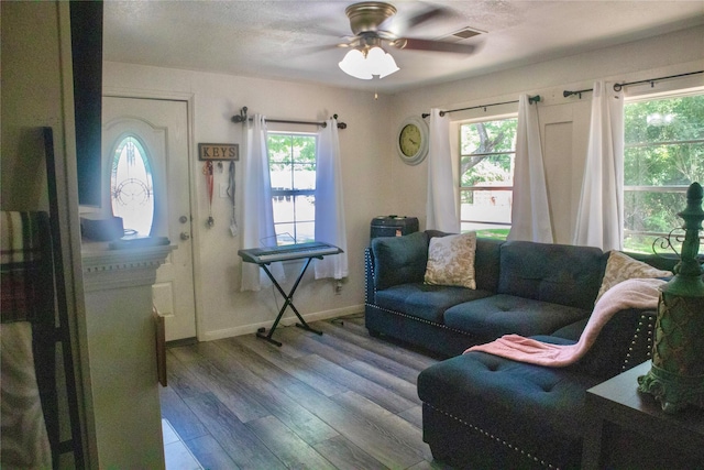 1315 N Roberson St, Conroe, TX 77301 - living room featuring healthy amount of natural light, ceiling fan, and wood finished floors